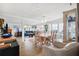 Open living and dining area featuring wood floors, an open floor plan, and access to outdoor patio at 18675 Us Highway 19 N # 261, Clearwater, FL 33764
