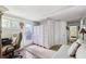 Multi-purpose room featuring bright light, a pullout sofa, and neutral colors, creating a relaxing work space at 18675 Us Highway 19 N # 261, Clearwater, FL 33764