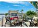 Inviting waterfront patio with comfortable seating, perfect for relaxing and enjoying tranquil water views on a sunny day at 18675 Us Highway 19 N # 261, Clearwater, FL 33764