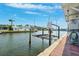 Scenic waterfront view of the property featuring a boat lift, easy access to the water at 18675 Us Highway 19 N # 261, Clearwater, FL 33764