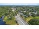 High-angle view of a home nestled in a tree-lined neighborhood with easy access to nearby roadways and natural landscapes at 19212 Sunlake Blvd, Lutz, FL 33558