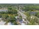 Aerial view showcasing the home's setting amid lush greenery, nearby lakes, and a well-connected road network at 19212 Sunlake Blvd, Lutz, FL 33558