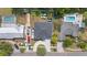 Overhead shot of a home with a large backyard and driveway, complemented by mature trees and neighboring properties at 19212 Sunlake Blvd, Lutz, FL 33558