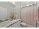 Updated bathroom featuring a vanity with marble counters, modern fixtures, and neutral tones at 19212 Sunlake Blvd, Lutz, FL 33558