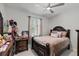 Comfortable bedroom featuring a beautifully decorated bed, soft lighting, and a serene ambiance at 19212 Sunlake Blvd, Lutz, FL 33558