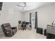 Bright, versatile room with tiled floors, desk, ceiling fan, and window, ideal for an office or guest space at 19212 Sunlake Blvd, Lutz, FL 33558