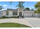 Charming single-story home featuring a well-manicured lawn, driveway, and an attached two-car garage at 19212 Sunlake Blvd, Lutz, FL 33558