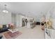 Open-concept living space featuring modern finishes, a spacious kitchen, and stylish decor at 19212 Sunlake Blvd, Lutz, FL 33558