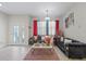 Cozy living room with elegant sofas, decorative accents, and plenty of natural light streaming through large windows at 19212 Sunlake Blvd, Lutz, FL 33558