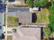 Overhead shot of two houses showing the layout of driveways, rooflines, and adjacent landscaping at 2018 21St S St, St Petersburg, FL 33712