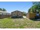 Backyard features a utility shed with ample green space at 2018 21St S St, St Petersburg, FL 33712