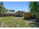 Backyard features a utility shed with ample green space at 2018 21St S St, St Petersburg, FL 33712