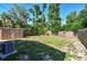 Backyard with a shed, air conditioning unit, and wooden fence at 2018 21St S St, St Petersburg, FL 33712