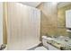 The bathroom features tan tile, granite countertops, and shower/tub combo at 2018 21St S St, St Petersburg, FL 33712