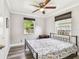 The bedroom features wood-look floors and a ceiling fan at 2018 21St S St, St Petersburg, FL 33712
