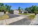 Charming home featuring a well-maintained lawn, large windows, and a driveway at 2018 21St S St, St Petersburg, FL 33712