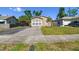 Cozy home with a well-kept lawn and a paved driveway leading to the house at 2018 21St S St, St Petersburg, FL 33712