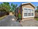 Charming home with a well-maintained lawn, large windows, and a paved driveway at 2018 21St S St, St Petersburg, FL 33712