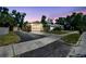 Charming home featuring a well-maintained lawn, large windows, and a driveway at sunset at 2018 21St S St, St Petersburg, FL 33712