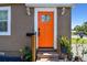 Charming home's entrance with a vibrant front door and a cozy, inviting feel at 2018 21St S St, St Petersburg, FL 33712