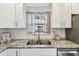 Bright kitchen features stainless appliances, granite countertops, and subway tile backsplash at 2018 21St S St, St Petersburg, FL 33712