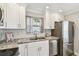 Bright kitchen features stainless appliances, granite countertops, and subway tile backsplash at 2018 21St S St, St Petersburg, FL 33712