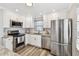 Bright kitchen features stainless appliances, granite countertops, and subway tile backsplash at 2018 21St S St, St Petersburg, FL 33712