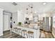Modern kitchen with stainless steel appliances, breakfast bar, and stylish pendant lighting at 2018 21St S St, St Petersburg, FL 33712