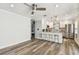 Comfortable living room transitions into a modern kitchen with stainless steel appliances at 2018 21St S St, St Petersburg, FL 33712