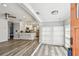 Open-concept living space flows into a modern kitchen with stainless steel appliances and breakfast bar at 2018 21St S St, St Petersburg, FL 33712