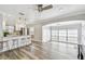Open living space with a modern kitchen, large windows and hardwood floors at 2018 21St S St, St Petersburg, FL 33712