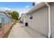The side of this home provides a narrow walkway to the backyard at 2252 Society Dr, Holiday, FL 34691