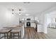 Bright kitchen features stainless steel appliances, white cabinets, and stone countertops at 2252 Society Dr, Holiday, FL 34691