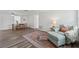 Bright living room features wood-look floors, neutral walls, a cozy chair, and a vintage rug for added charm at 2252 Society Dr, Holiday, FL 34691
