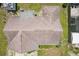 Aerial view of the roof, showing a well maintained backyard and an outdoor screened in area at 2626 Cheryle Ln, Sarasota, FL 34237