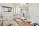 Well-lit bathroom with granite countertops, a single sink, and ample storage at 2626 Cheryle Ln, Sarasota, FL 34237
