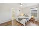 Bright bedroom with a queen bed, ceiling fan and access to the en suite bathroom at 2626 Cheryle Ln, Sarasota, FL 34237