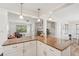 Stylish kitchen with granite countertops open to the living room at 2626 Cheryle Ln, Sarasota, FL 34237