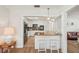 Bright kitchen featuring white cabinets, granite countertops, and modern black appliances at 2626 Cheryle Ln, Sarasota, FL 34237