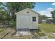Exterior view of a shed with a wooden ramp, a window, and some visible weathering at 2626 Cheryle Ln, Sarasota, FL 34237