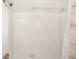 Bright shower space with white tile and modern showerhead at 2626 Cheryle Ln, Sarasota, FL 34237