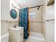 Well-maintained bathroom with a tub, shower, patterned curtain, and vanity sink for personal care at 2627 8Th N Ave, St Petersburg, FL 33713