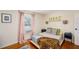 Well-lit bedroom featuring wood floors, a comfortable bed, and pastel decor for a serene ambiance at 2627 8Th N Ave, St Petersburg, FL 33713