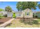 Charming single-story home featuring a vibrant green door and well-maintained front yard at 2627 8Th N Ave, St Petersburg, FL 33713