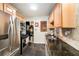 Modern kitchen with stainless steel appliances, black countertops, and updated backsplash at 2627 8Th N Ave, St Petersburg, FL 33713