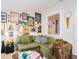 Stylish living room featuring a comfortable green sofa and unique wall art at 2627 8Th N Ave, St Petersburg, FL 33713