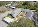 Aerial view of condo community with lush landscaping, parking, and covered parking at 2725 Countryside Blvd # 103, Clearwater, FL 33761