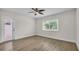 Bright bedroom with modern flooring and a window at 281 44Th Ave, St Pete Beach, FL 33706
