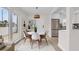 Bright dining area with modern table, chairs, and a view of the exterior at 281 44Th Ave, St Pete Beach, FL 33706