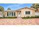 Charming single Gathering home featuring well-maintained landscaping and a brick paver driveway at 281 44Th Ave, St Pete Beach, FL 33706